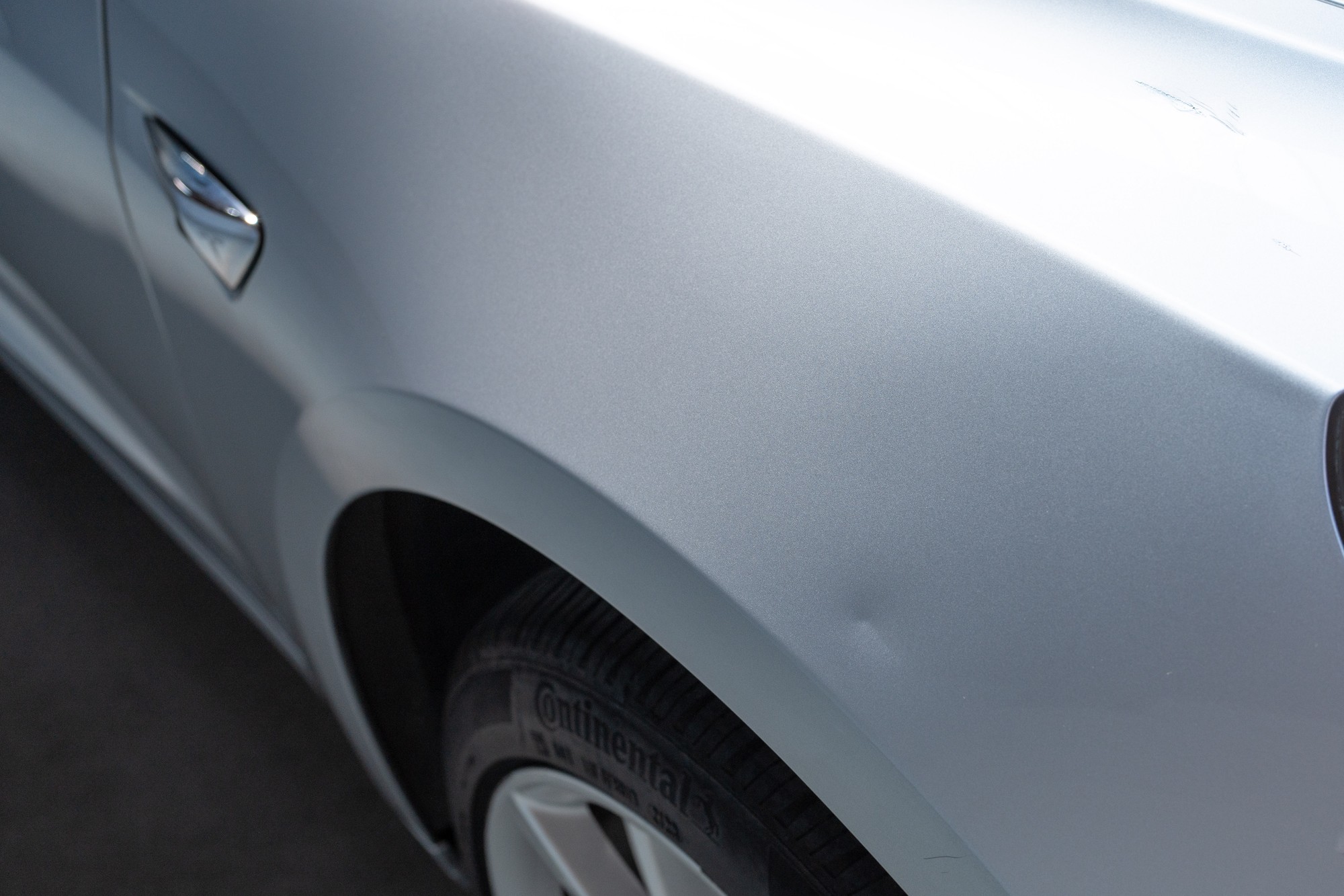 Dent on passenger side front fender