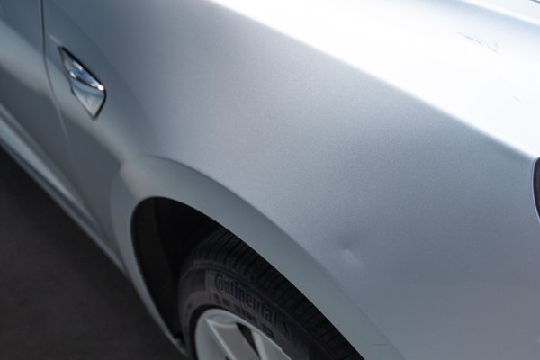 Dent on passenger side front fender