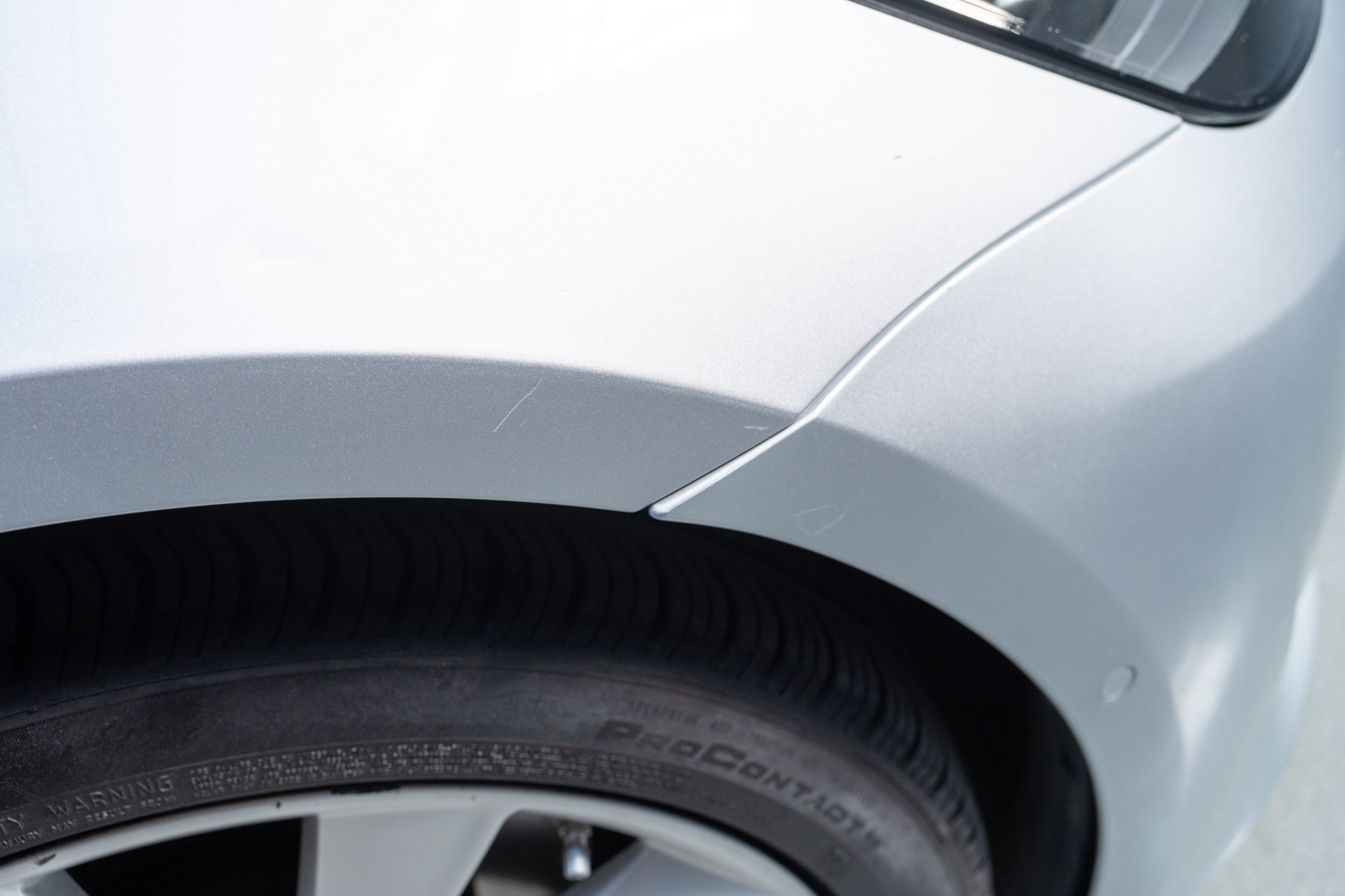Minor scratch on passenger side front fender