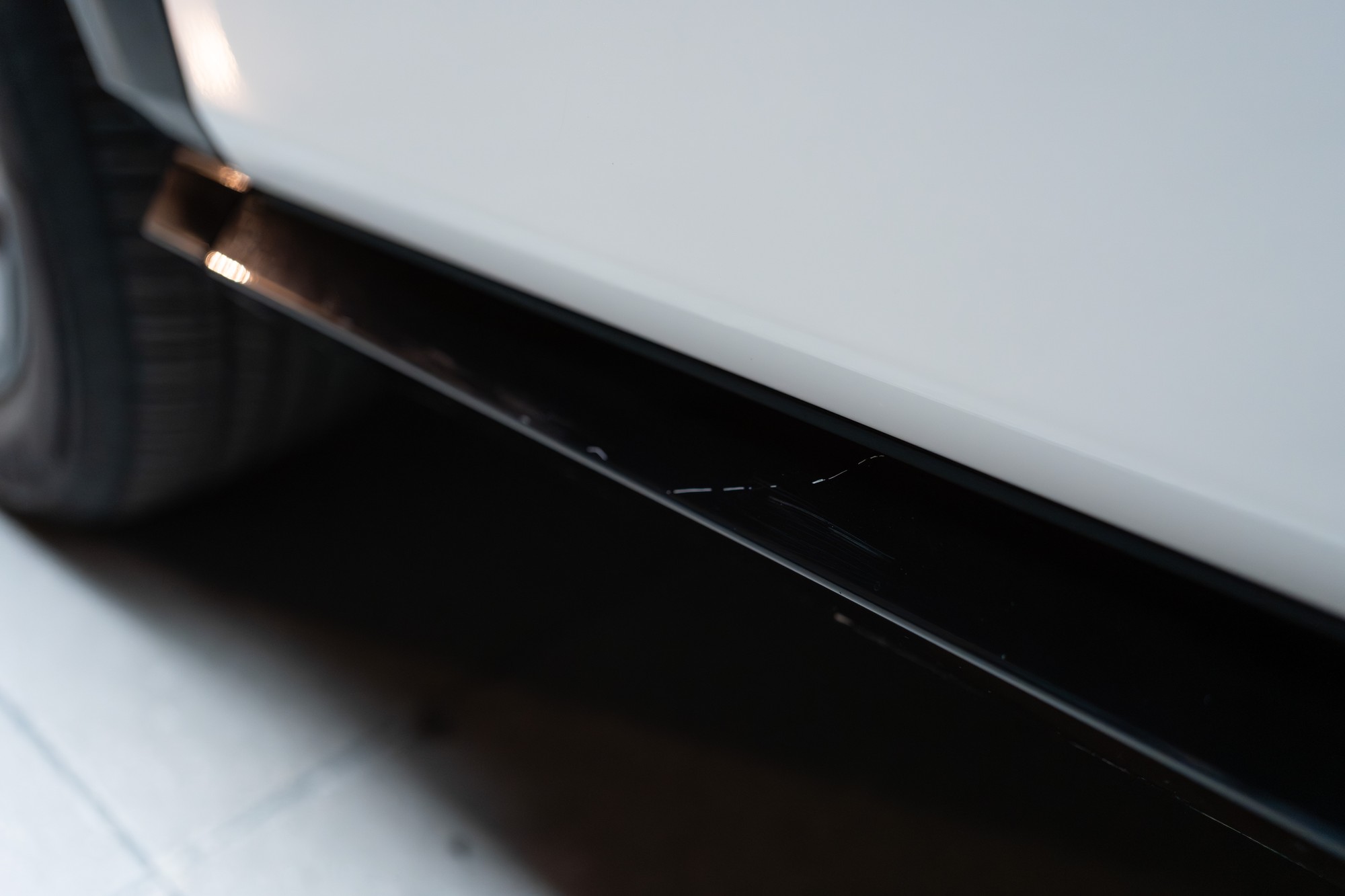 Scratch on driver's side lower rocker panel trim