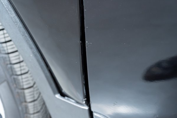 Touched up chip on driver side front door