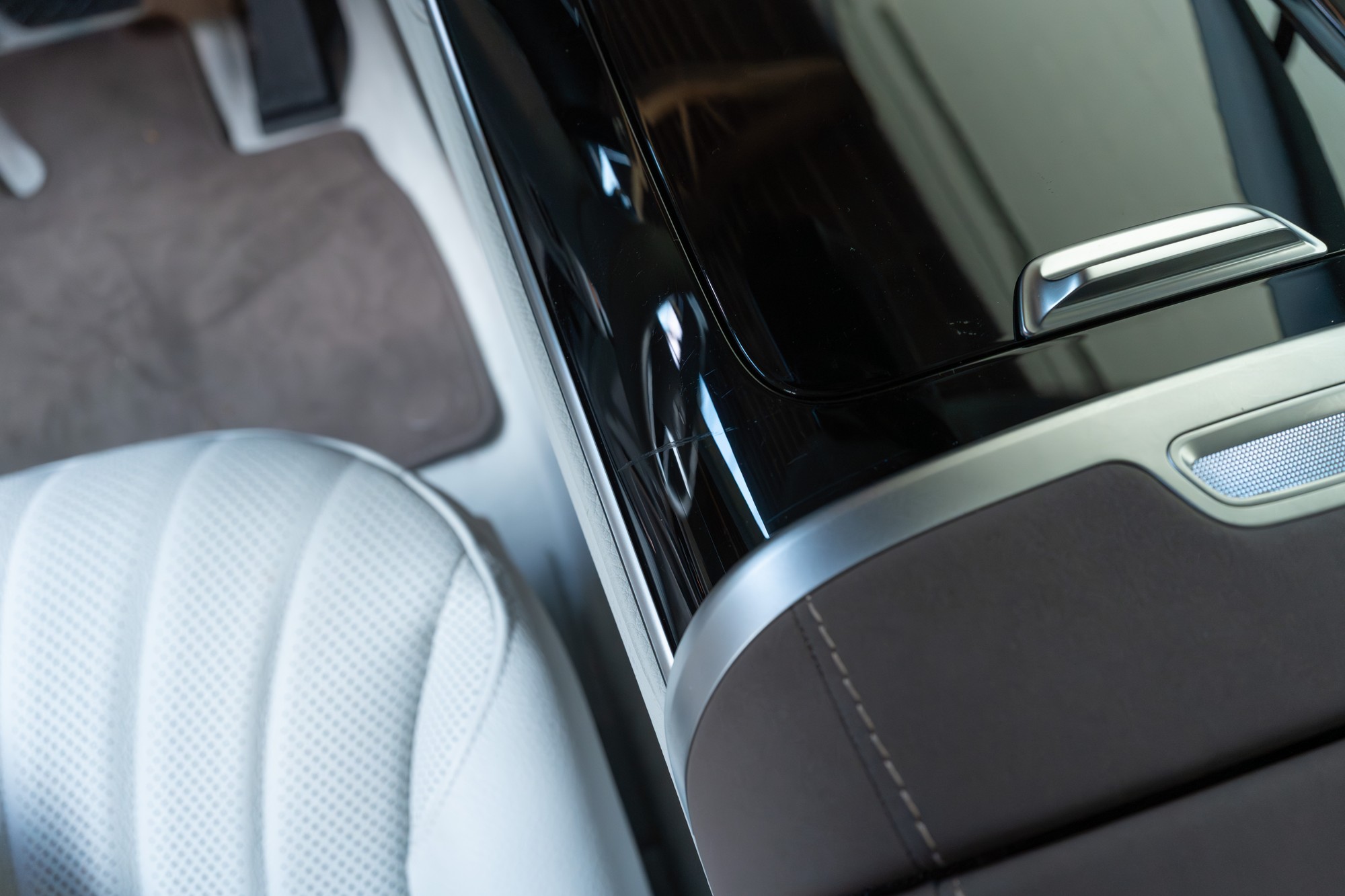 Light scratch on center console black plastic trim